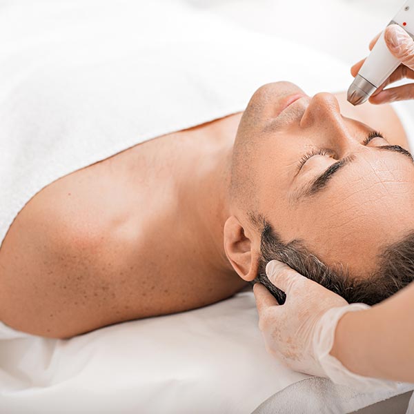 Man receiving a wrinkle reduction treatment.