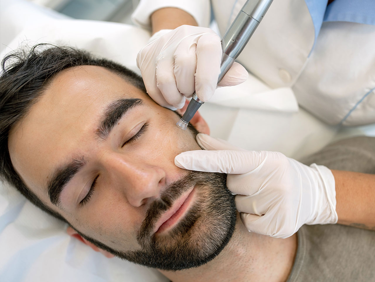 Doctor giving a man a SkinTyte treatment.