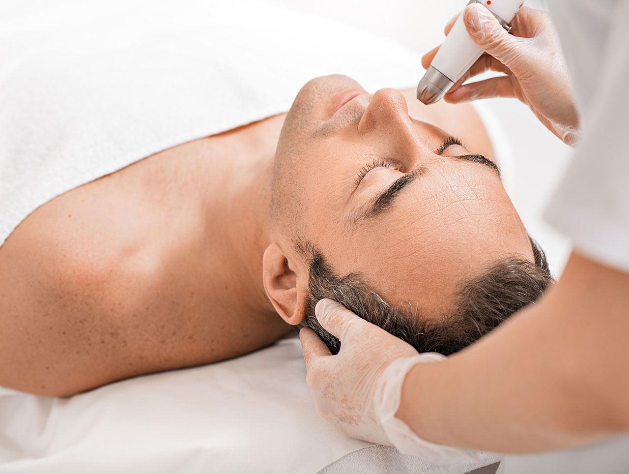 Man receiving a wrinkle reduction treatment.