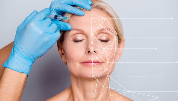 Woman receiving treatment prior to facial cosmetic surgery